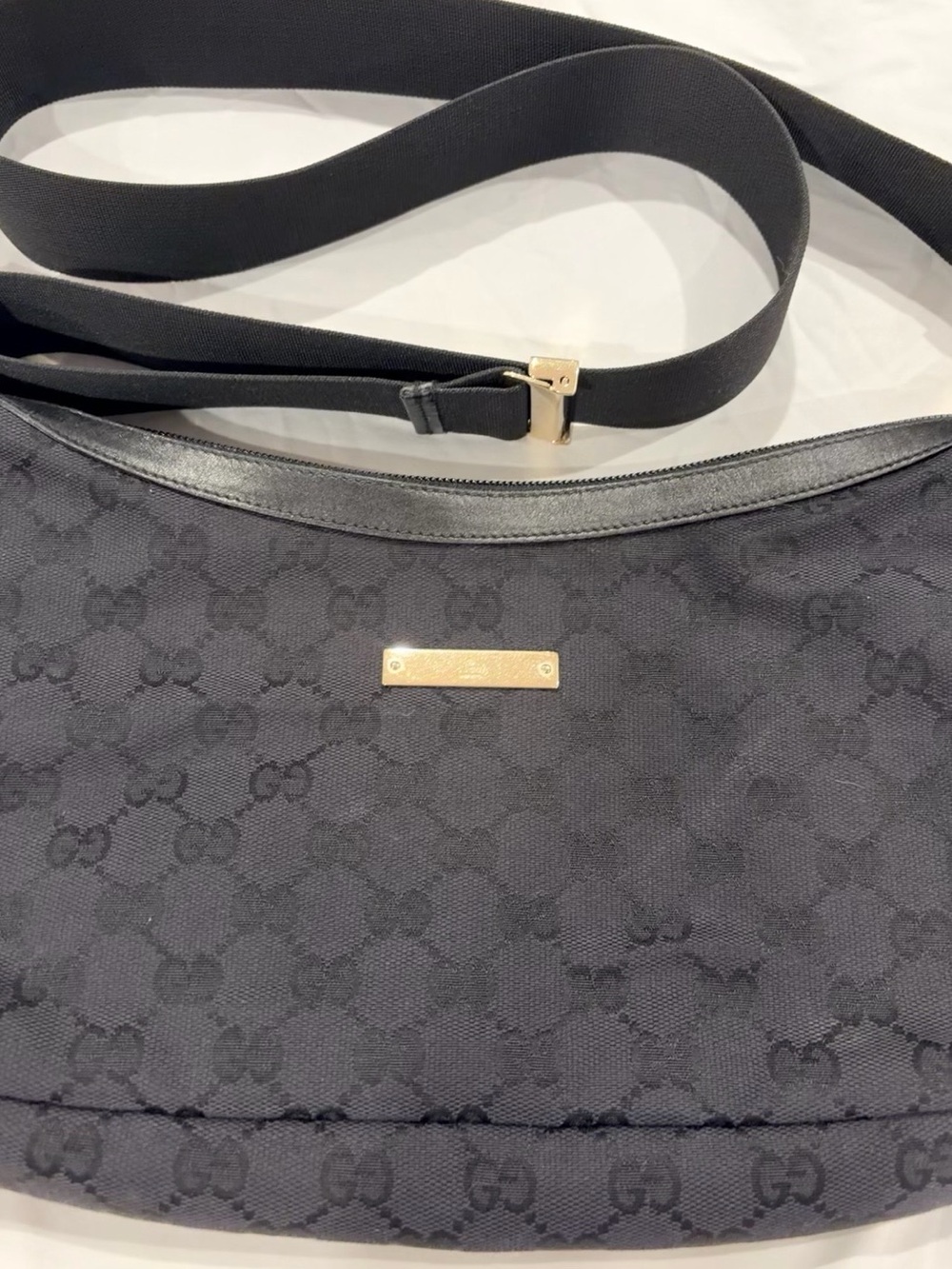 Authentic Gucci Black GG Canvas Round Messenger Bag with Gold Hardware